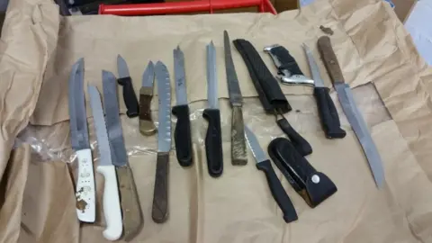 Gwent Police Several knives and weapons laid out on a table