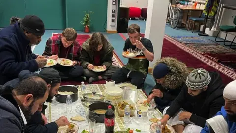 Haverfordwest Central Mosque  Members of the community breaking a fast at an Iftar