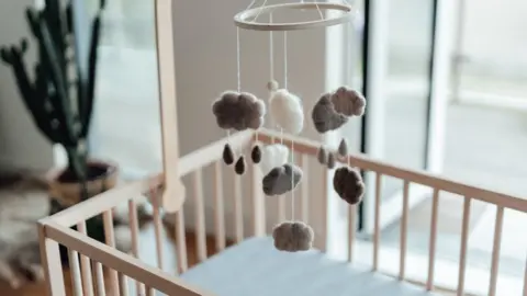 Getty/Oscar Wong Charity Baby Basics issued an appeal for cots after being forced to close their waiting list.