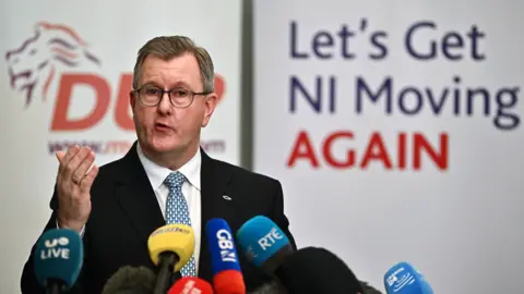 Getty Images Democratic Unionist Party (DUP) leader Sir Jeffrey Donaldson addresses the media following a meeting with 120 executive members of the DUP on a possible deal to restore the devolved government on 30 January 2024 in Belfast, Northern Ireland