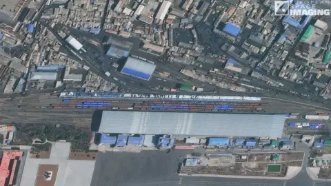 Maxar (supplied by European Space Imaging) A satellite image of trains at the Sinuiju rail station in North Korea