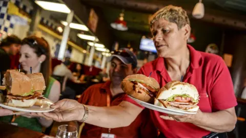 Getty Images A waitress in Toronto last month