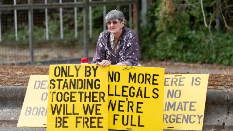 Stefan Rousseau/PA Protester outside Wethersfield airbase