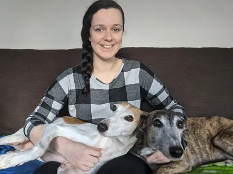 Sophie Batchelor  Photo of Sophie and her two support dogs