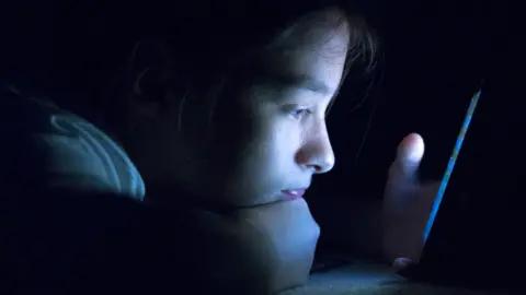 Young person in dark