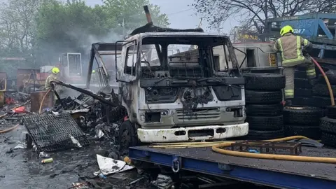 Burnt-out truck in fire