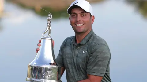 Francesco Molinari with the Arnold Palmer Invitational trophy