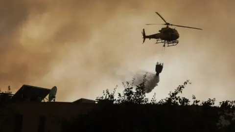 EPA A helicopter fights a forest fire in Vila Cha, Lousa, Portugal, 15/10/2017