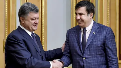 Alamy Ukraine's president Petro Poroshenko and Mikhail Saakashvili shake hands during a meeting in 1 June 2015