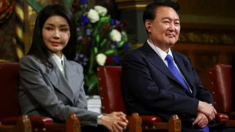 Reuters South Korea's President Yoon Suk Yeol with his wife Kim Keon Hee