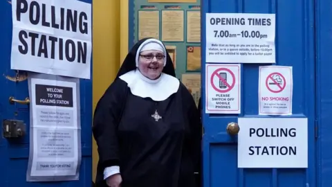 Getty Images Nun outside a polling station