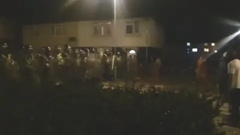 Rioters throw fireworks at police