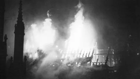 PA Media The fire burning in the night