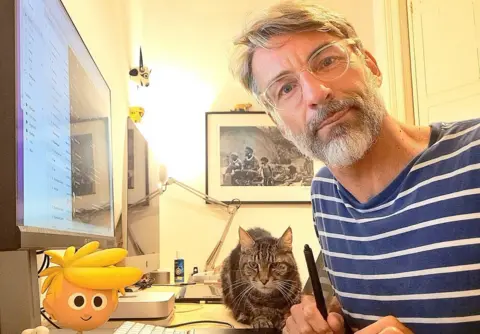 Courtesy of Vin Vogel Vin Vogel in front of his computer