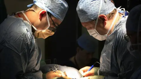 Getty Images surgeons carry out a transplant