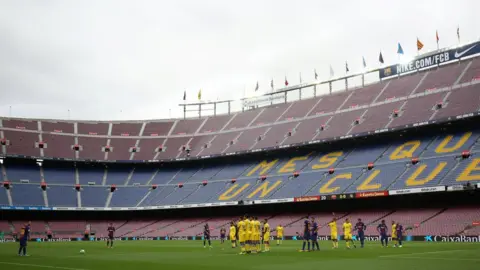 Reuters General view as Barcelona's Lionel Messi prepares to take a freekick in the empty stadium