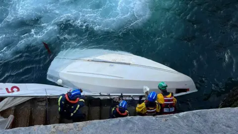 PEEL COASTGUARD Coastguard with upturned dinghy