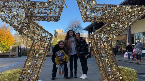 From left to right, Anna Barwick holding her son Logan, Lesley Wilson and Lilybet Rowland