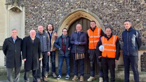 Ipswich Borough Council Group photo of councillors, architects, sounds East and members of construction crew outside the church