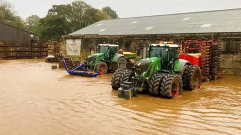 Neil MacLeod Tractors in flooding