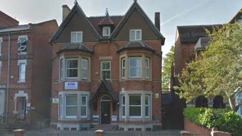 Google 1900s three-storey house with "Youth Offending Service" sign