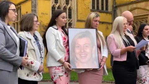 Family of Celia Marsh outside Ashton Court in Bristol