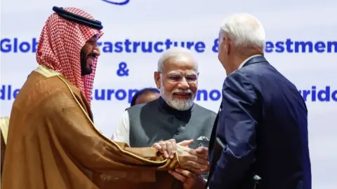 Getty Images Saudi Arabia's Crown Prince and Prime Minister Mohammed bin Salman (L), India's Prime Minister Narendra Modi (C) and US President Joe Biden attend a session as part of the G20 Leaders' Summit at the Bharat Mandapam in New Delhi on September 9, 2023. (Photo by EVELYN HOCKSTEIN / POOL / AFP) (Photo by EVELYN HOCKSTEIN/POOL/AFP via Getty Images)