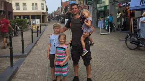 Laurence Dolman Laurence Dolman with his nine-year-old son Henry, and daughters Bethan, seven, and Eliza, three