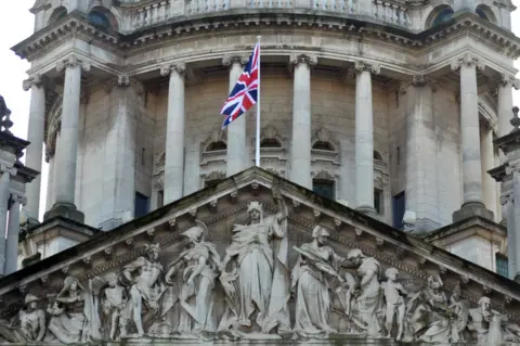 Pacemaker The Union flag flying at Belfast City Hall