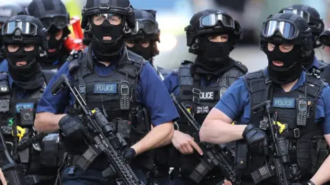 Getty Images Counter-terrorism officers near the scene of the attack