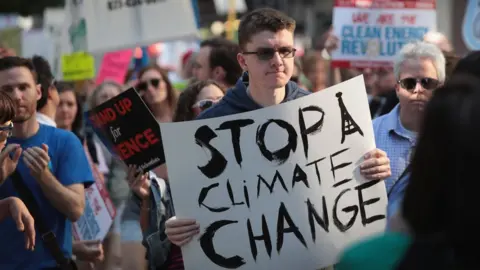 Demonstrators in Chicago on the day the US decides to exit the Paris pact