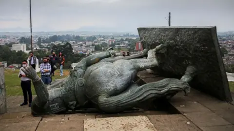 AFP The statue of Sebastian de Belalcazar, a 16th century Spanish conqueror, lies on the ground after it was pulled down by indigenous in Popayan, Cauca department, Colombia on September 16, 2020.