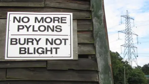 Anti-pylons sign, with pylon in background