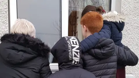 Donna Duffy Like many families, the Duffys' only face-to-face contact is through a care home window