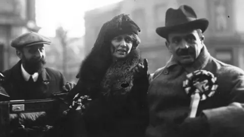 Getty Images Lady Astor succeeded her husband, Waldorf Astor (right), as MP for Plymouth when he was elevated to the House of Lords