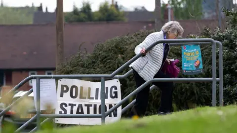 EPA-EFE/REX/Shutterstock Woman at polling station