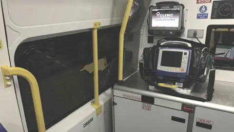 West Midlands Ambulance Service Damage to the window after ambulance attacked