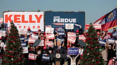 Getty Images Vice-President Mike Pence speaks to the crowd during a rally in support of Sen David Purdue and Sen Kelly Loeffler