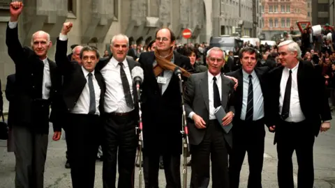 Sean Dempsey John Walker, Paddy Hill, Hugh Callaghan, Chris Mullen MP, Richard McIlkenny, Gerry Hunter and William Power outside the Old Bailey in London after their convictions were quashed