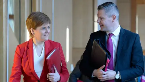 Getty Images Derek Mackay and Nicola Sturgeon