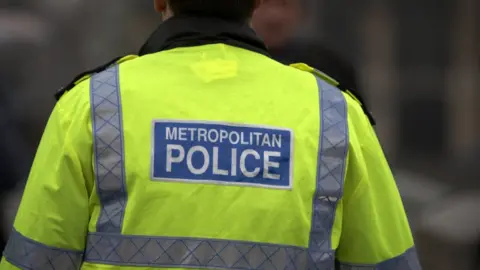 Getty Images  Back of a Metropolitan Police officer in uniform