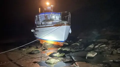 Mevagissey Coastguard Rescue Team Boat on rocks