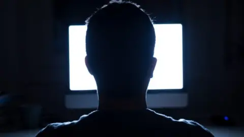 Getty Images Man on computer