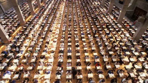 Alamy University students at exam hall, Royal Horticultural Hall, London