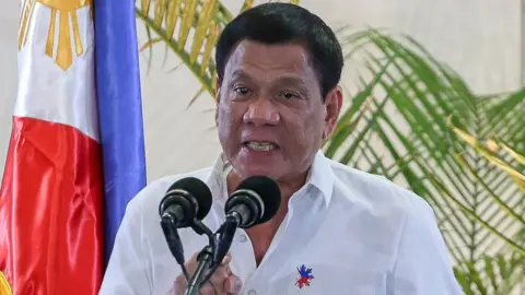 Getty Images Philippine President Rodrigo Duterte at a press conference shortly after arriving from Singapore at Davao international airport in southern island of Mindanao, 17 December 2016