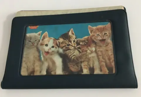 BBC Rumiko Masumoto's driver's licence, in a cover with kittens on it, which was found in her car when she was kidnapped