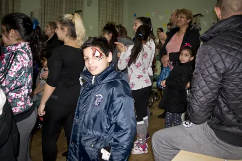 Laura Balogova Roma boy at a family celebration