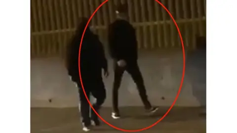 Psni Two suspects dressed in dark clothing