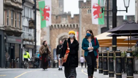 Getty Images Woman with facemask in Cardiff