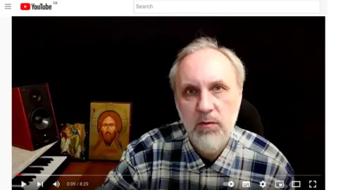 YouTube/ПРАВОСЛАВНЫЙ ВИРТУАЛЬНЫЙ ПРИХОД A picture from a sermon posted on YouTube in which Father Ioann Kurmoyarov said Russian aggressors in the conflict would go to hell.